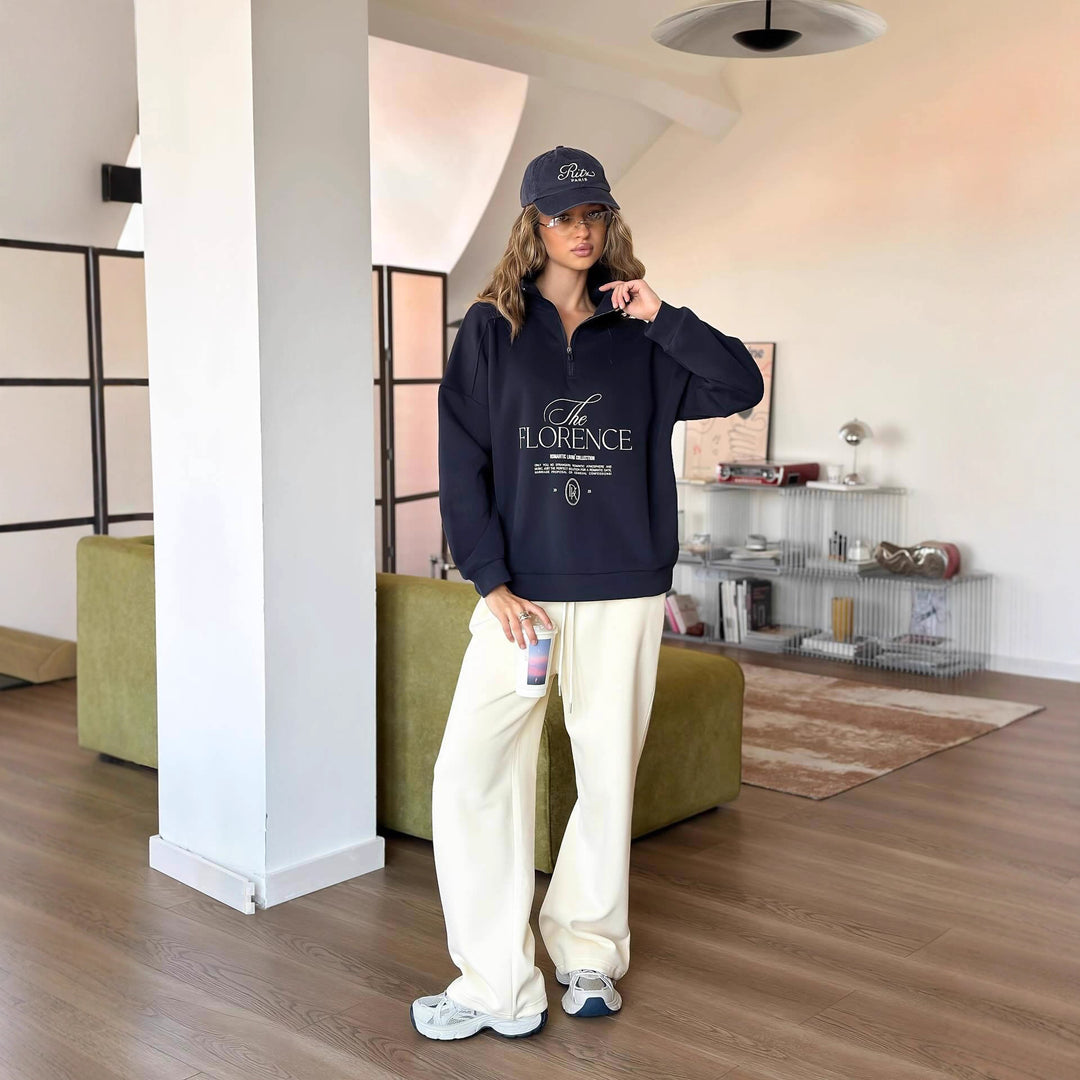 Kvinders statement sweater med høj krave og praktisk lynlås Stilla