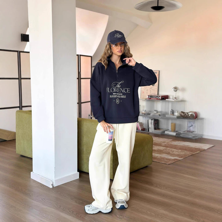 Kvinders statement sweater med høj krave og praktisk lynlås Stilla