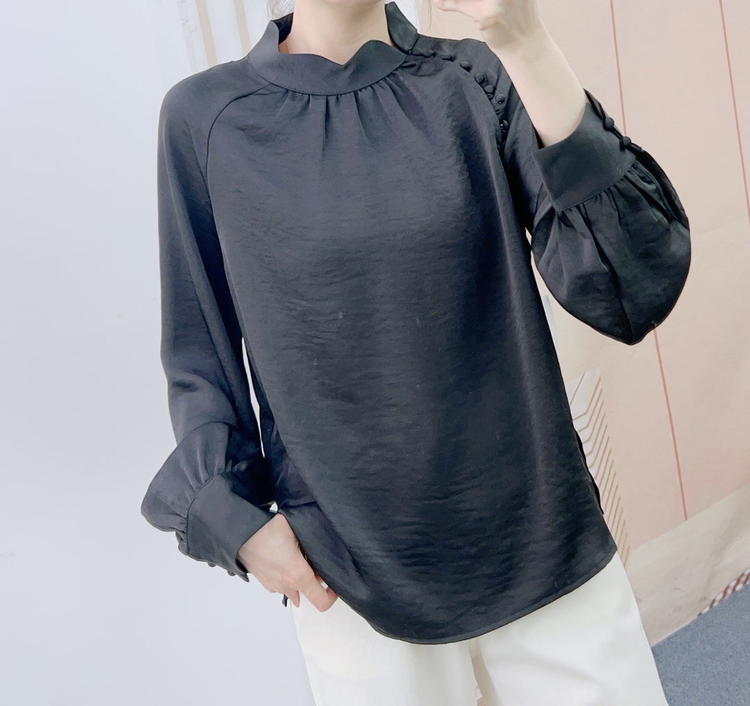Damebluse med dekorative puffærmer og elegant ståkrave Stilla