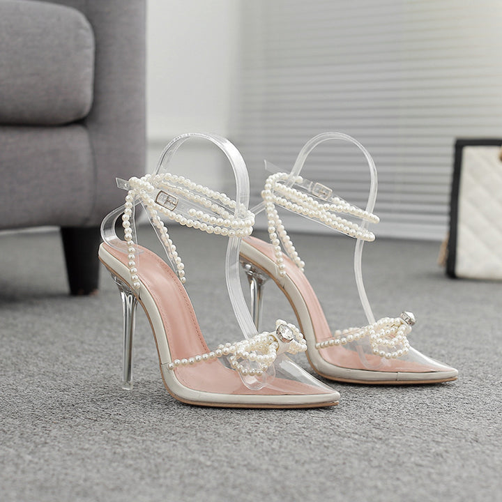 Dame transparente højhælede sko med elegante perle detaljer og stilfuld rem Stilla