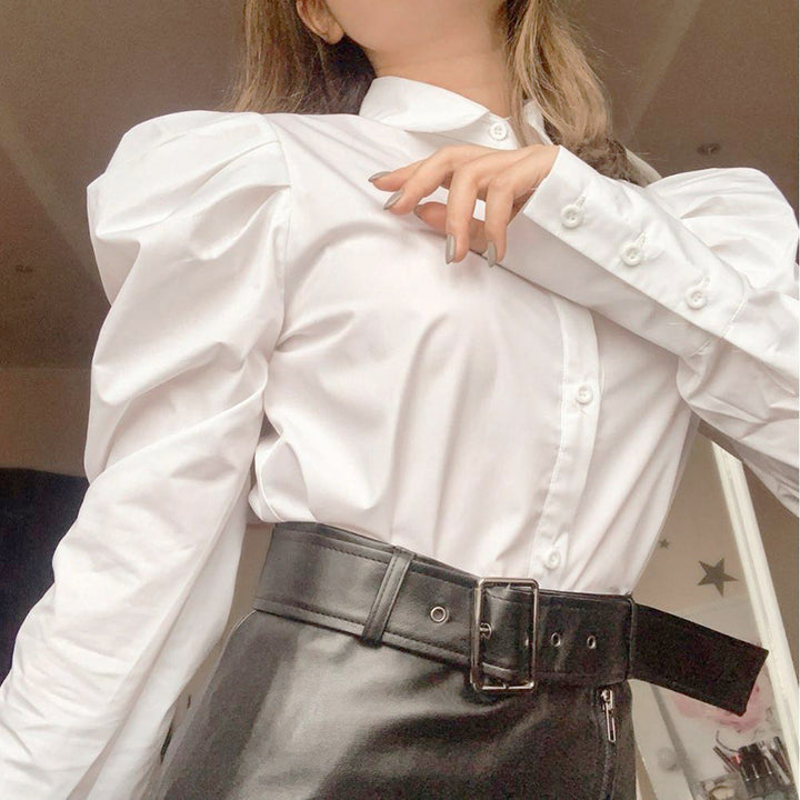 Damebluse med voluminøse puffærmer og elegant ståkrave Stilla