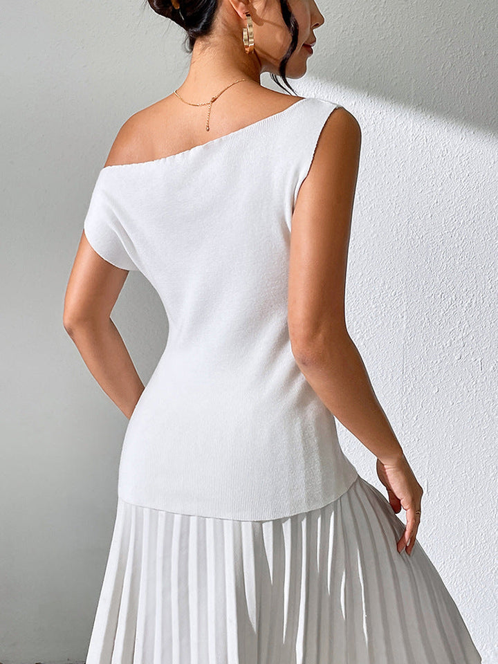 Skovae | Ensfarvet ærmeløs top med off-the-shoulder strikkedesign