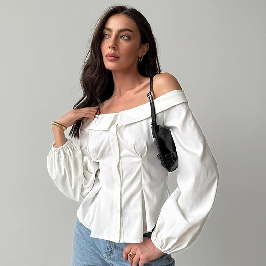 Damebluse med asymmetrisk udskæring og voluminøse ærmer Stilla