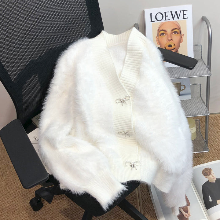 Kvinders fluffy cardigan med elegant knapdekoration Stilla