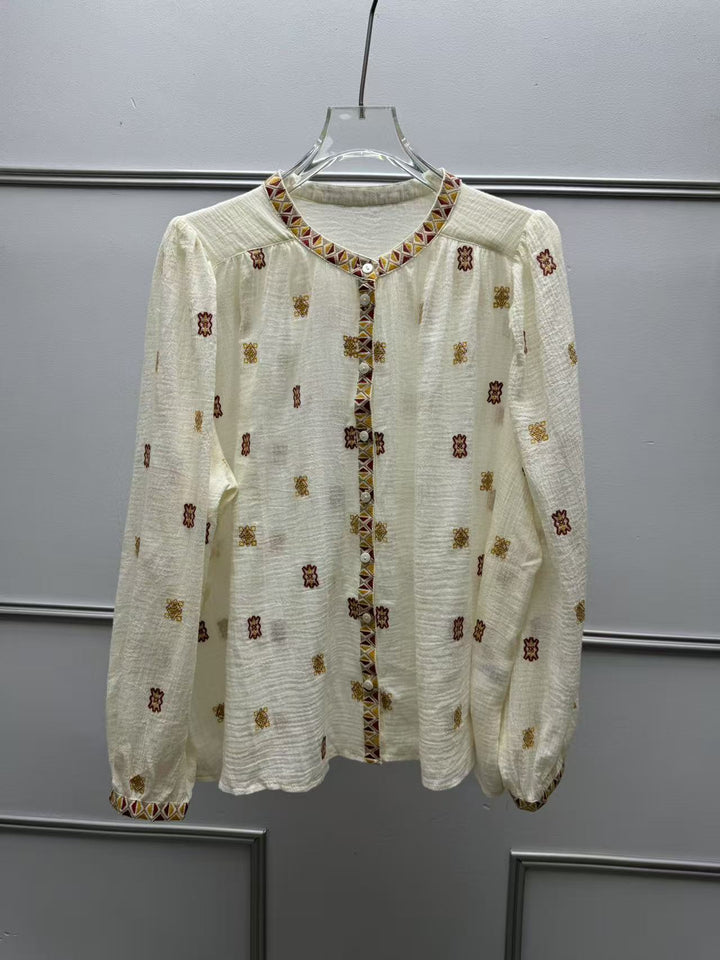 Damebluse med kunstnerisk broderedesign og stilfulde detaljer Stilla