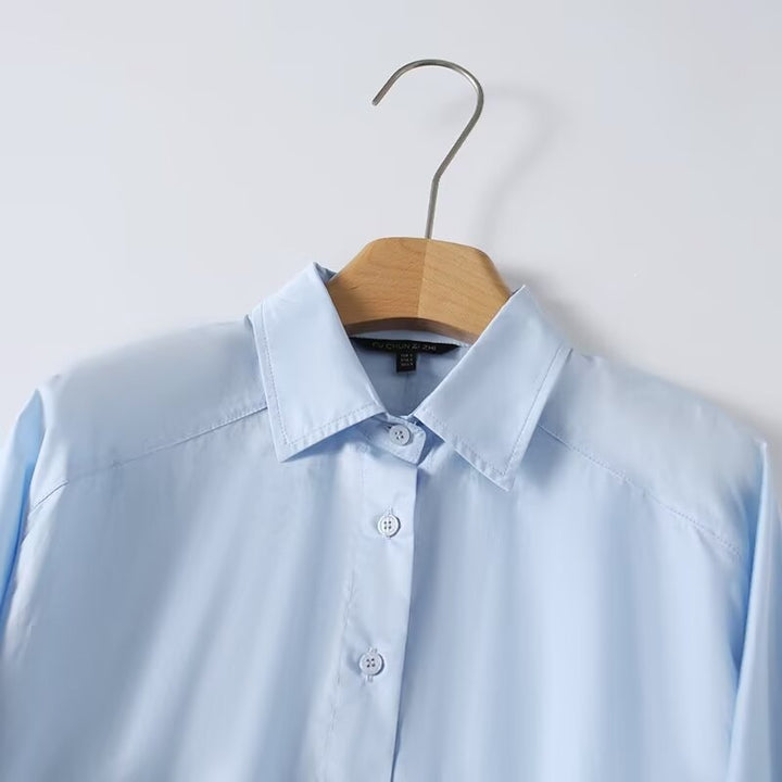 Dame elegant langærmet bluse med moderne detaljer og struktureret stof Skovae
