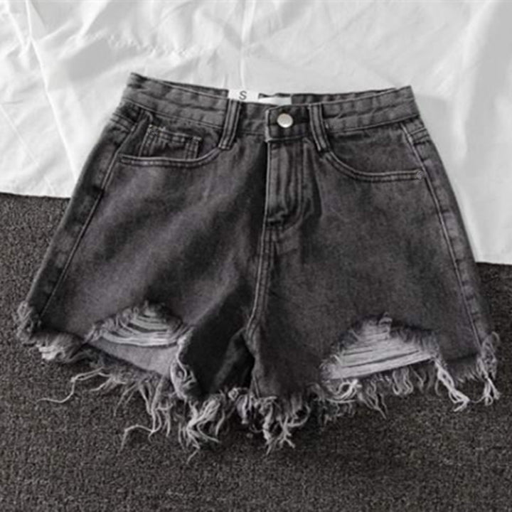 Kvinders ødelagte denimshorts med høj talje og frynset kant