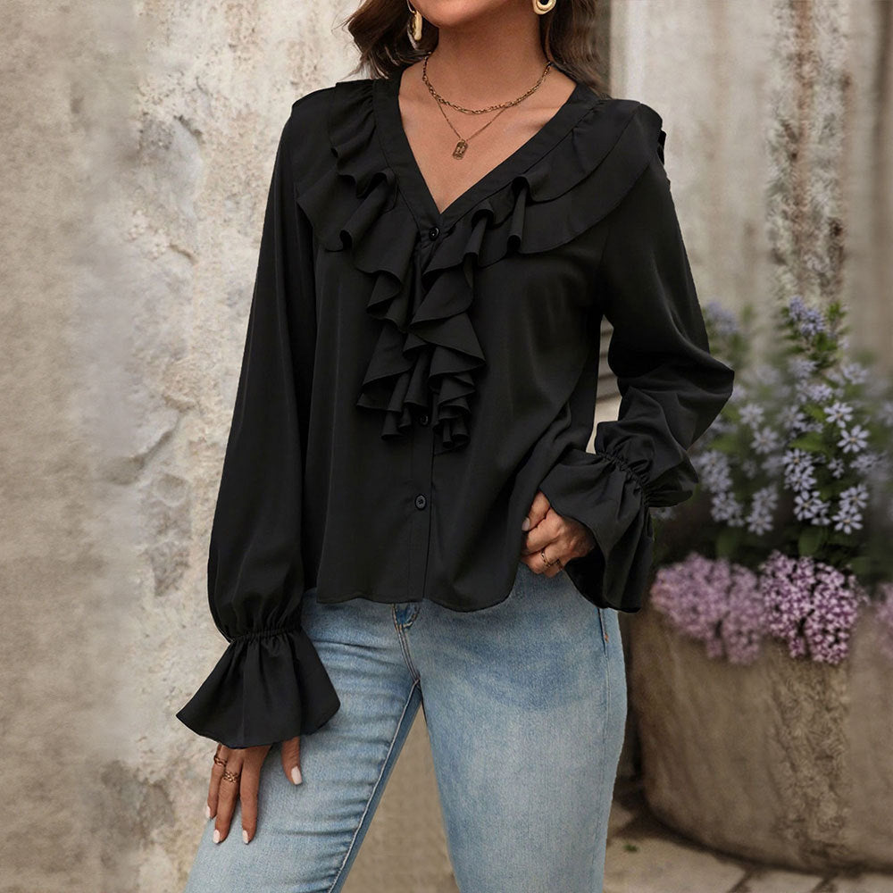Damebluse med elegante ruffle-detaljer og chic V-hals Stilla