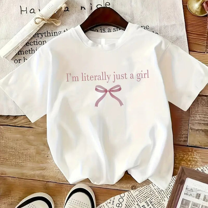 Dame T-shirt med sødt sløjfedesign og inspirerende citat Stilla