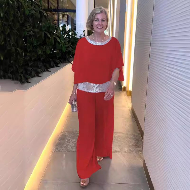 Dame elegant jumpsuit med flydende overdel og glitrende taljebånd Stiila