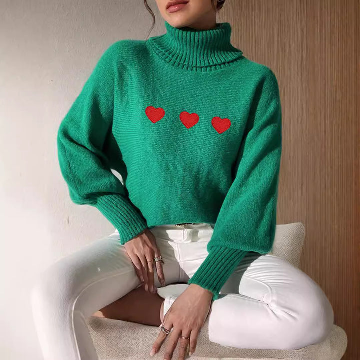 Kvinders sweater med høj krave og legende hjerteapplikationer Stilla
