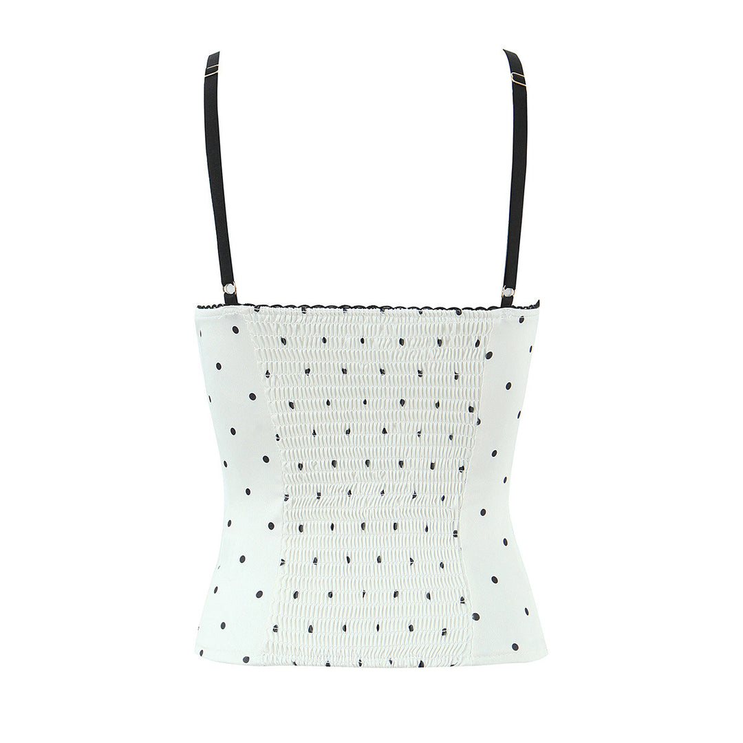 Dameoverdel med elegant polka-dot-look og fine detaljer Skovae