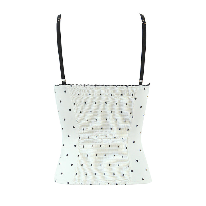 Dameoverdel med elegant polka-dot-look og fine detaljer Skovae