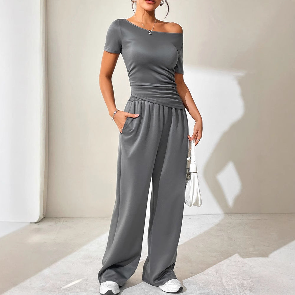 Dame jumpsuit med asymmetrisk snit og bredt skåret ben Skovae