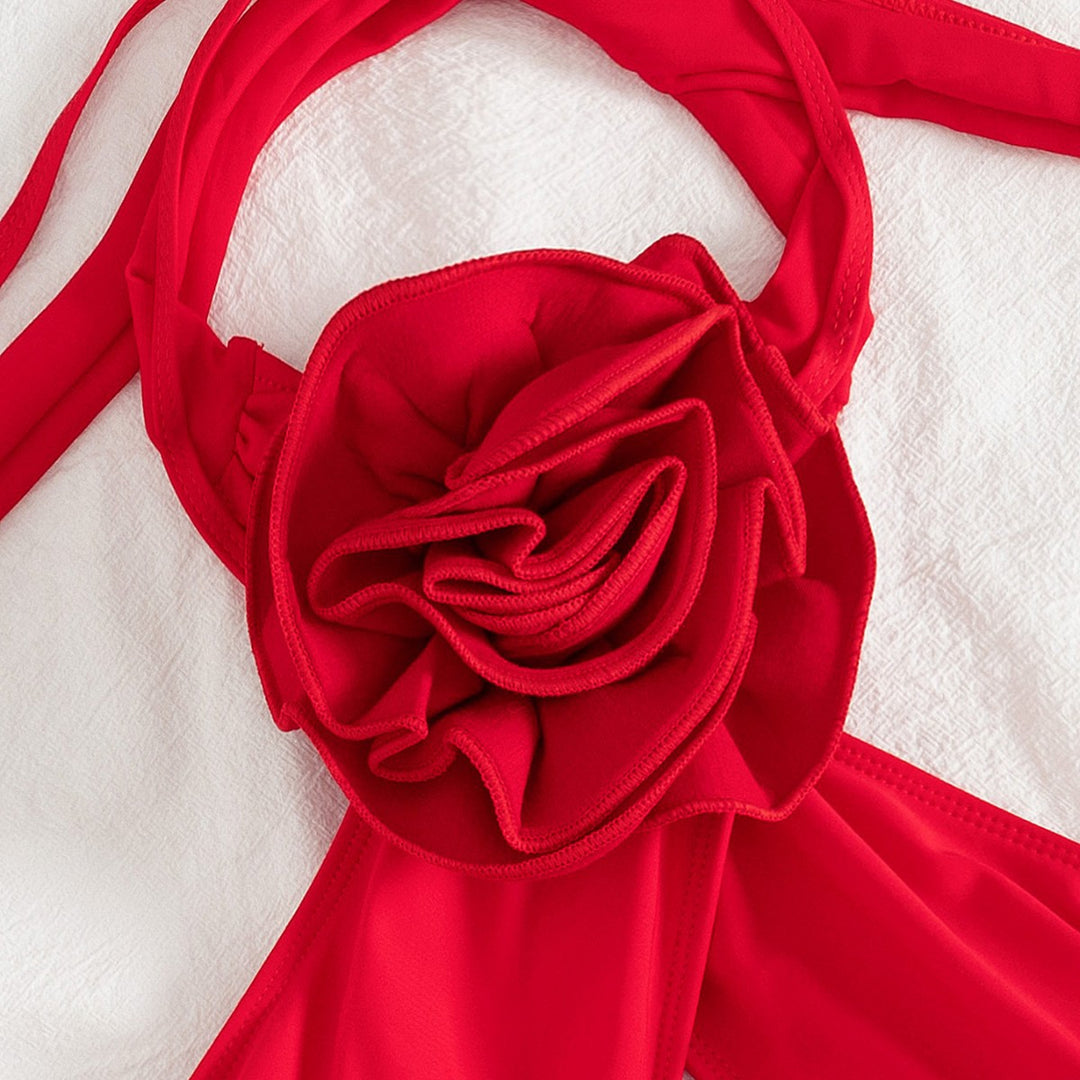 Dame badedragt med elegant omslagdesign og blomsterapplikation Stilla