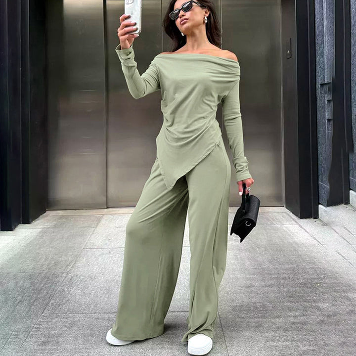 Dame jumpsuit med off-shoulder design og elegant draperet stof Stilla