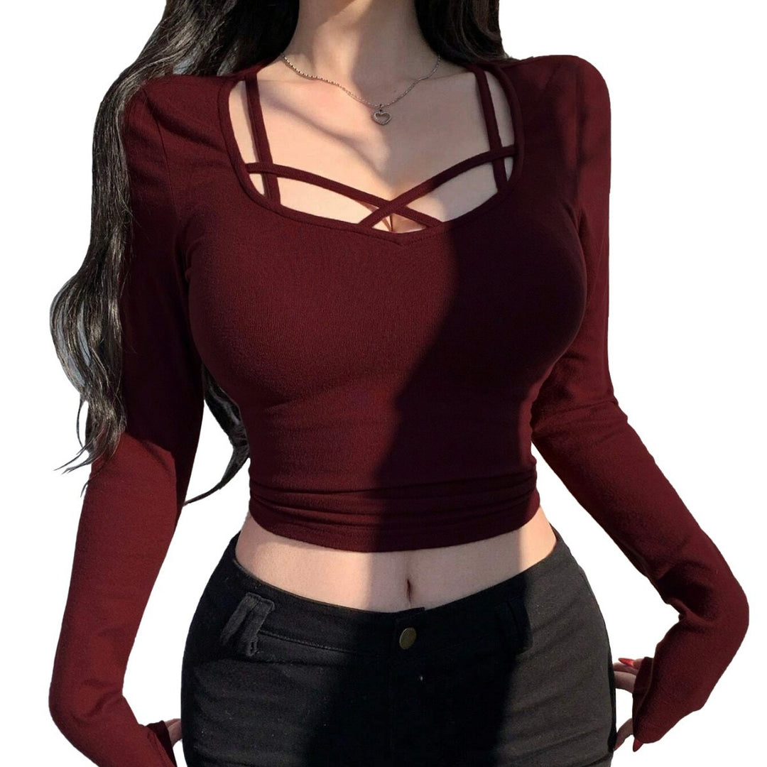 Kvinders langærmet cropped top med elegant snit og dekorative knuder Stilla