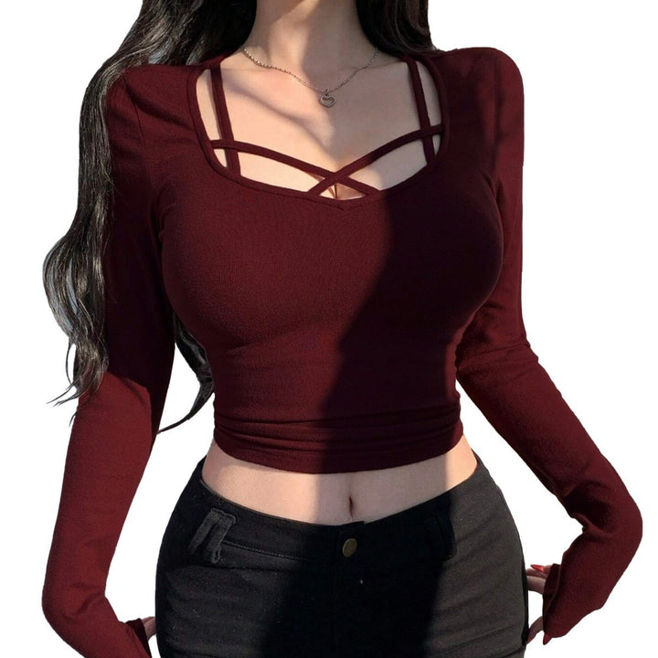 Kvinders langærmet cropped top med elegant snit og dekorative knuder Stilla