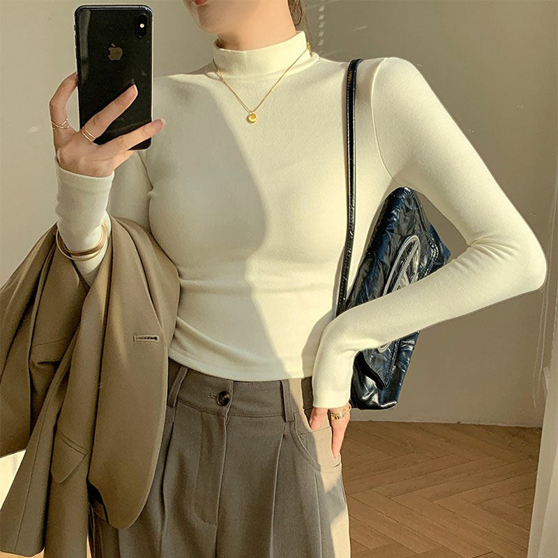 Kvinders langærmet crop top med høj krave og tætsiddende pasform