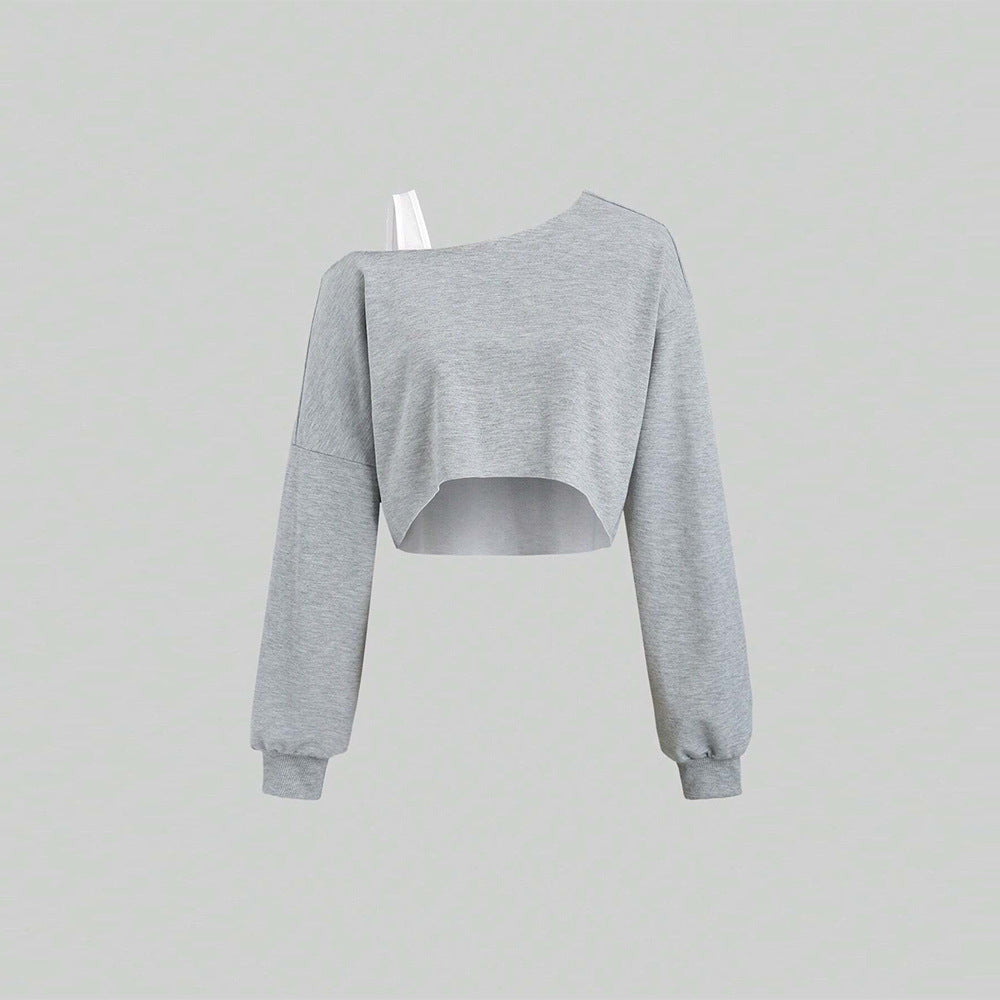 Kvinders cropped sweatshirt med asymmetrisk design og voluminøse ærmer Stilla