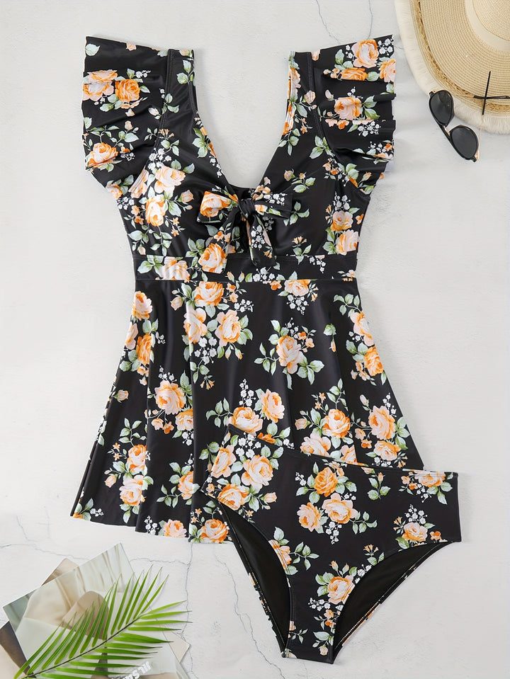 Dame én-delt badedragt med ruffledetails og blomstret design Skovae