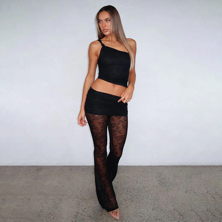 Dame asymmetrisk top med elegant spidsdetaljer og figursyede leggings Skovae