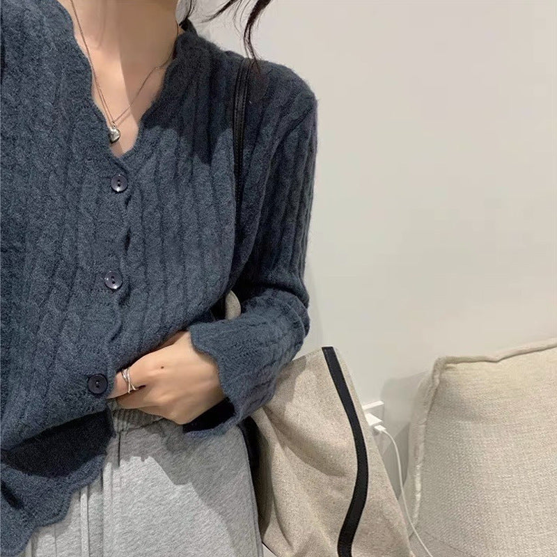Kvindernes cardigan med struktureret kabelmønster og elegante knapdetaljer Stilla