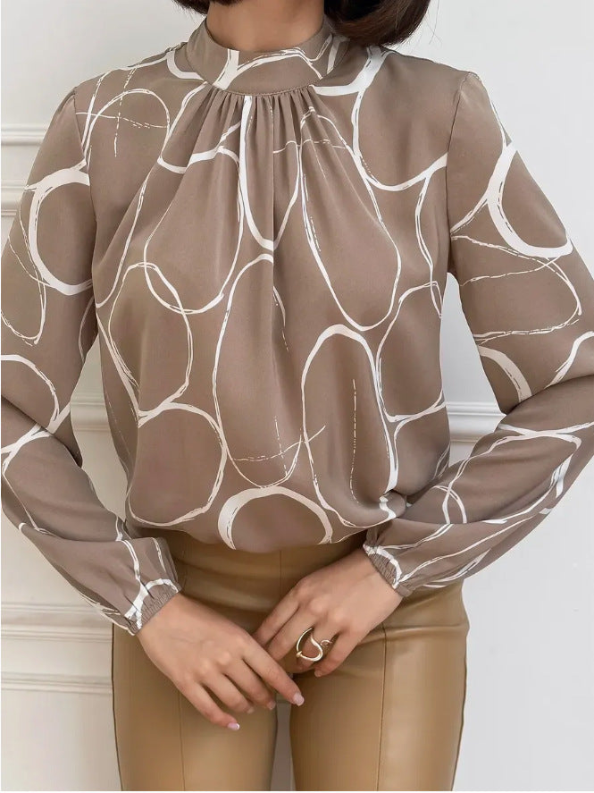 Damebluse med elegant blomsterdesign og bredt ærme Stilla