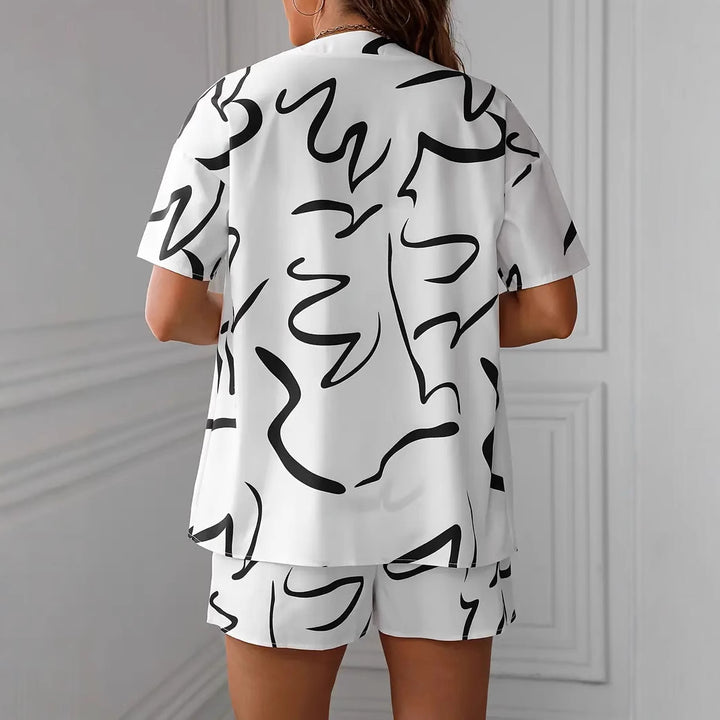 Dame Zvejedele deltid kombination med løs bluse og shorts i tropisk design Stilla