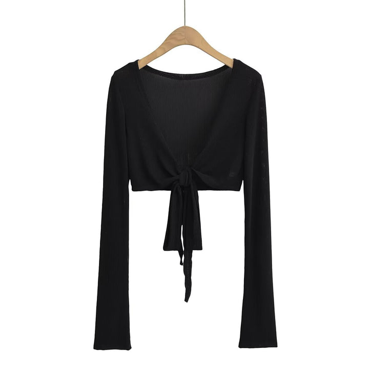 Dame cropped langærmet top med raffineret knude-design og elastisk stof Stilla