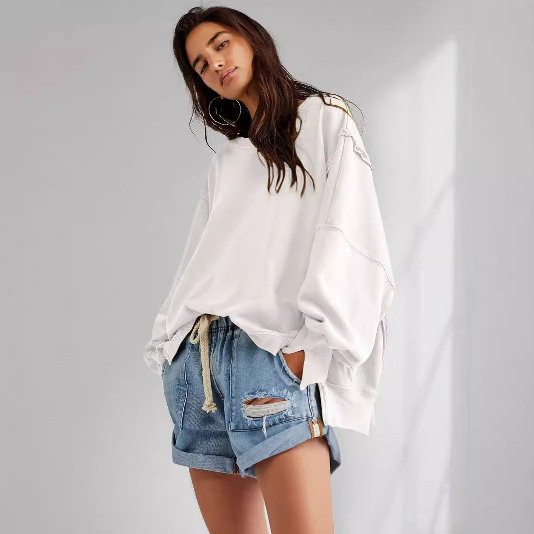 Dame afslappet oversized pullover med innovativt snit og fast stof Stilla