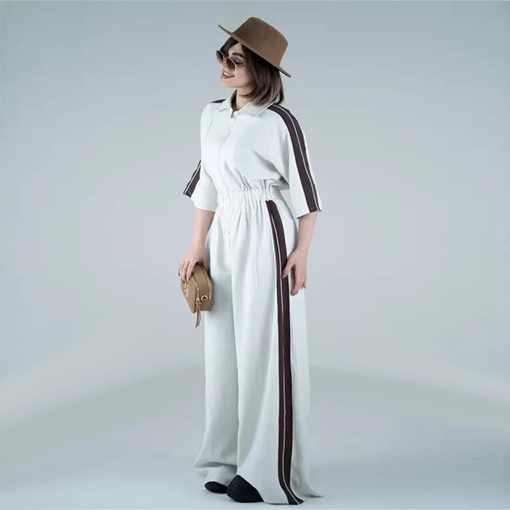 Kvinders lang jumpsuit med talje og kontraststriber