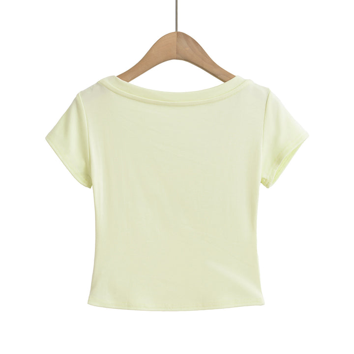 Dame crop-top med elegant rund hals og glitrende skrift Stilla