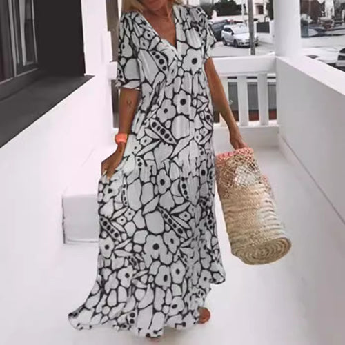 Dame Maxi-kjole med blomsterdesign og svingende kant Stilla