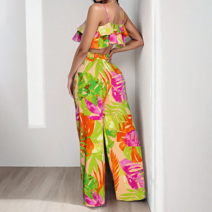 Dame to-delt sommeroutfit med ruffle-bluse og vide bukser Stilla