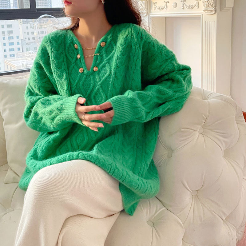Dame chunky strik sweater med knapdetaljer og kabelmønster Stilla