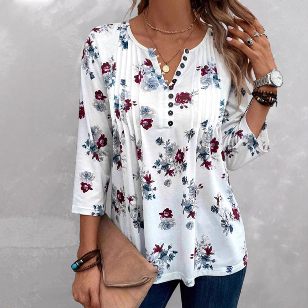 Damebluse med florale accenter og knapper Stilla