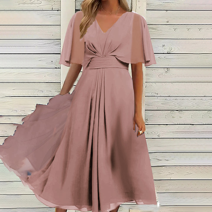 Dame Svingende Elegant Maxikjole med feminine Flæseærmer og Wrap-look Stilla