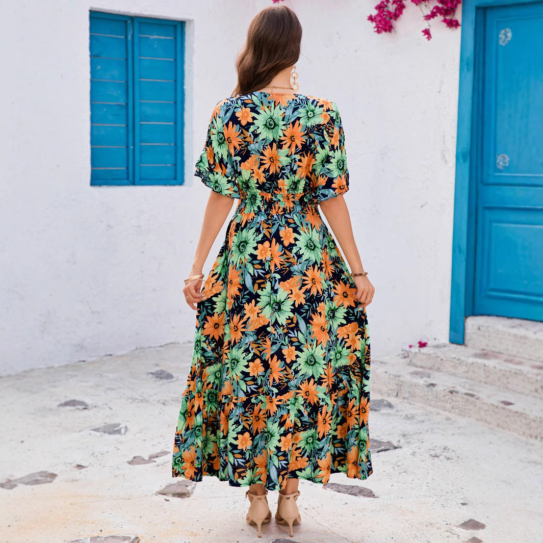 Dame maxikjole med blomstret design og svingende kant Stilla