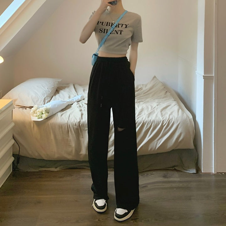 Kvinders casual brede sweatpants med fashionable udskæring og elastisk talje.
