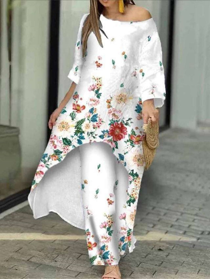 Dame maxikjole med blomsterdesign og asymmetrisk kant Stilla