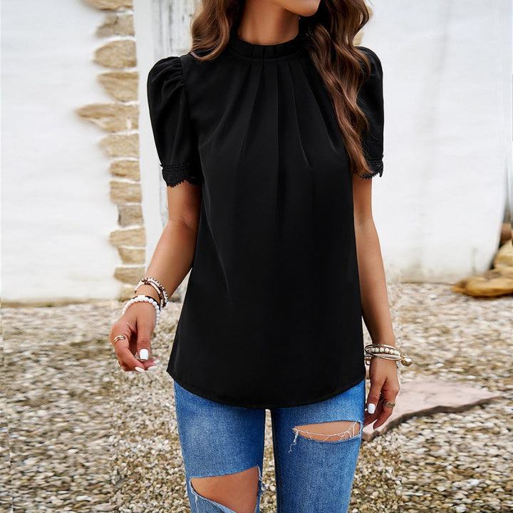Damebluse med elegante puffærmer og fine spidsaccentuer Stilla