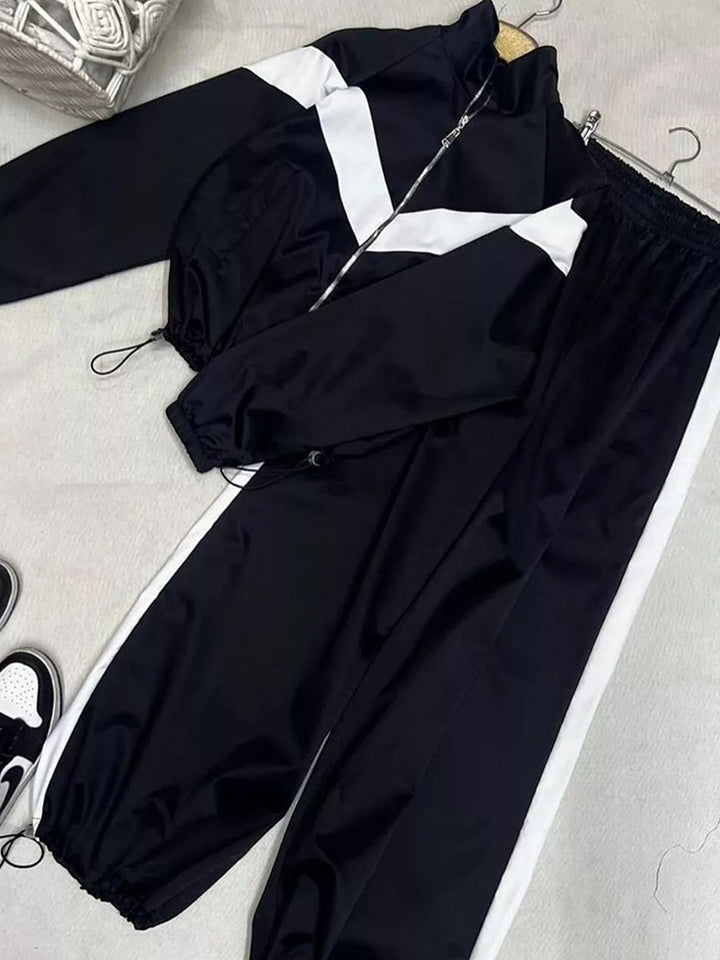Kvinders sporty vindjakke med elastiske manchetter og reflekterende detaljer Skovae