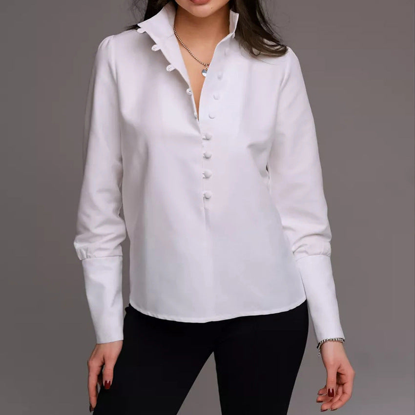 Damebluse med høj ståkrave og elegante pufærmer Stilla