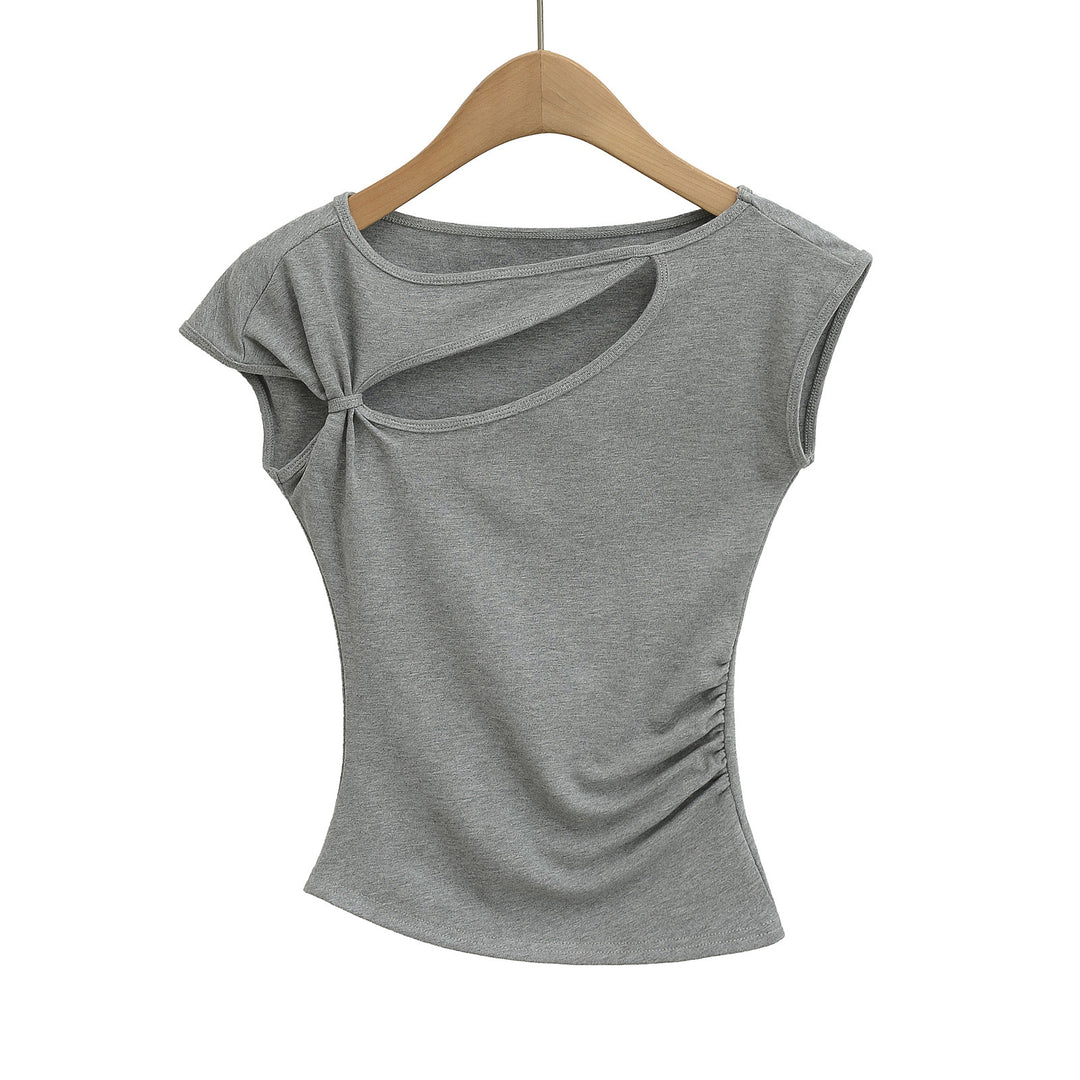 Dame sportslig top med asymmetrisk snit og modige cut-out-detaljer Stilla