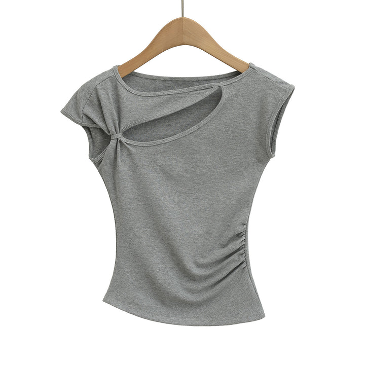 Dame sportslig top med asymmetrisk snit og modige cut-out-detaljer Stilla