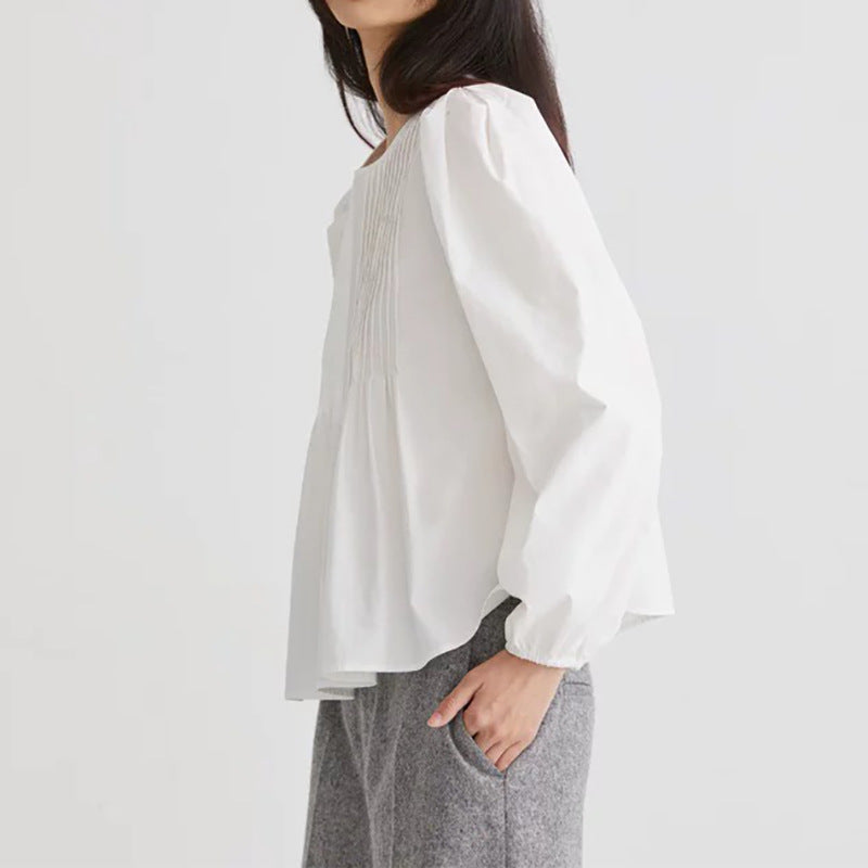 Damebluse med plisserede detaljer og voluminøse ærmer Stilla