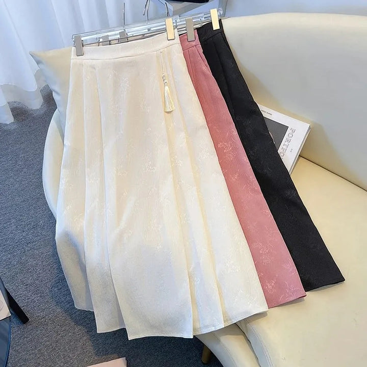 Kvinders elegante midi-nederdel med tekstureret stof og svajende snit