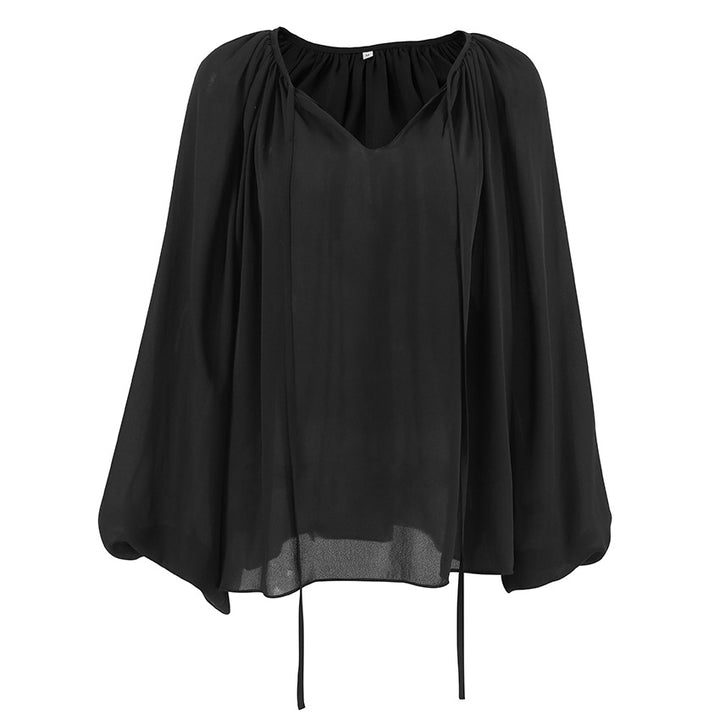Damebluse med voluminøse ærmer og V-udskæring i let chiffon Stilla