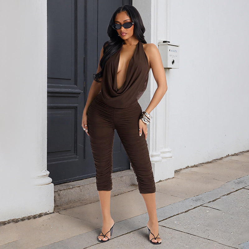 Damer elegant og figursyet jumpsuit med dyb V-udskæring og draperinger Skovae